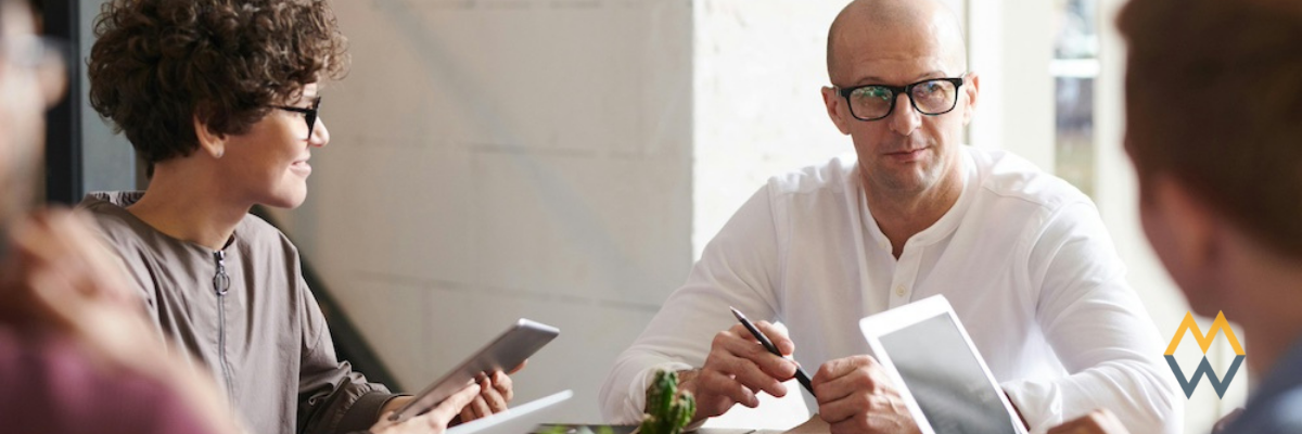 A team of employees at a table meeting