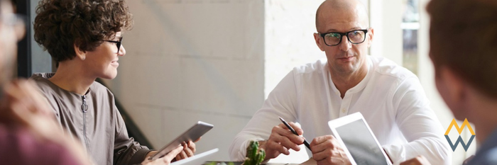 A team of employees at a table meeting