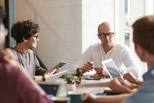 A team of employees at a table meeting